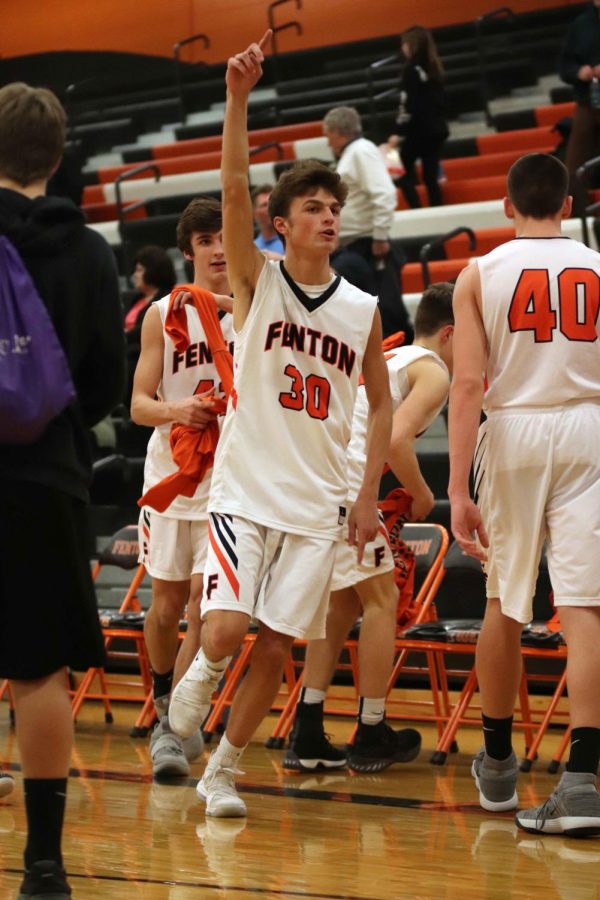 After winning their game sophomore Ryan Miller celebrates the win. The JV boys basketball team played hard for a second win against the linden eagles. 