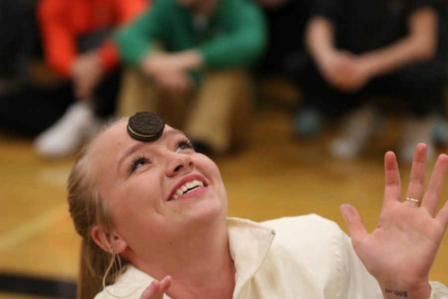 In hopes of winning the event, senior Molly Gundry attempts to get an Oreo into her mouth. The sophomores ended up winning the winter pep assembly and received the spirit stick.