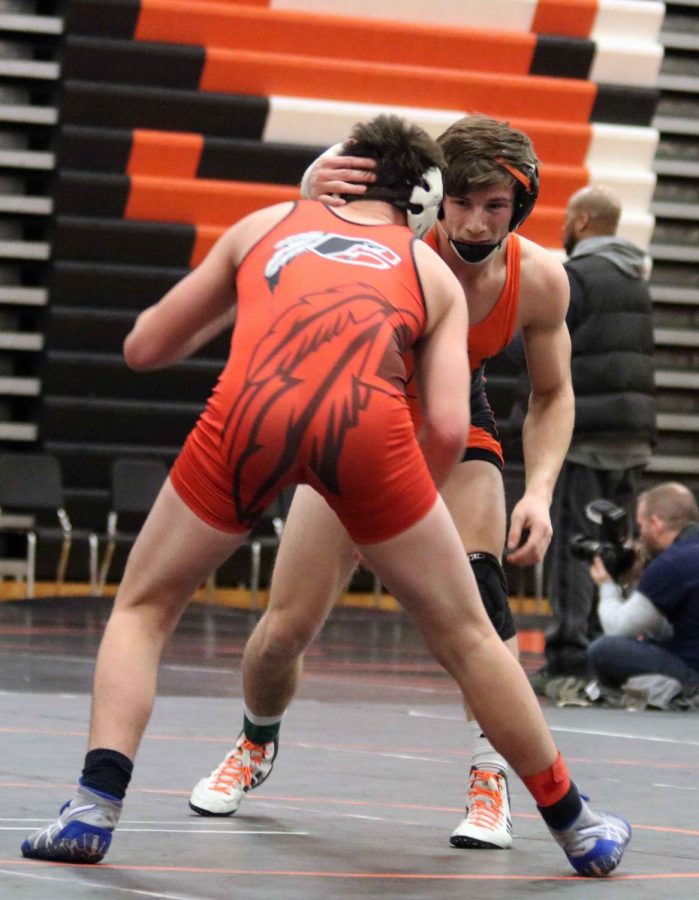 Senior, Tommy Adams prepares to pin another wrestler from Clinton High School. Adams has been participating in the wrestling program all four years of high school, and was named captain. 