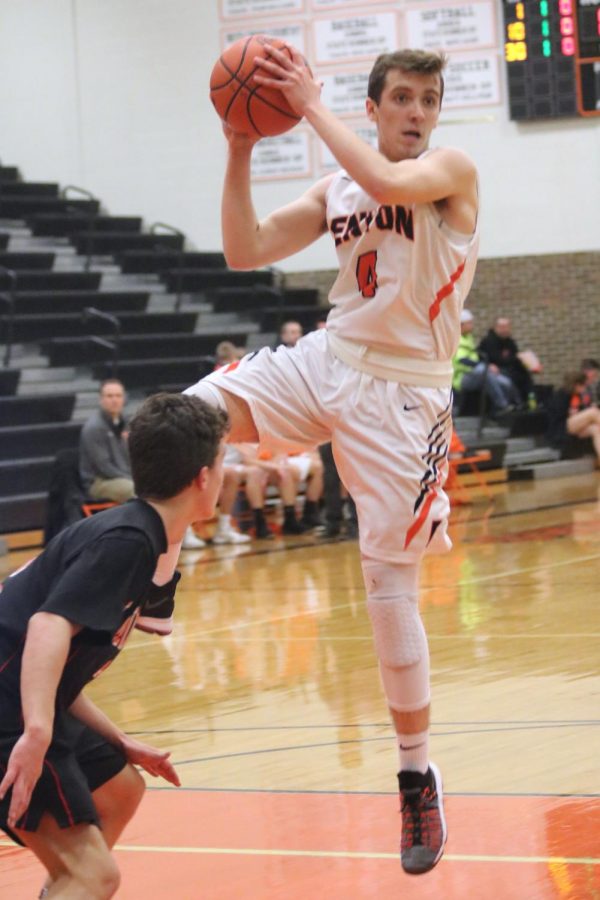 Sophomore Braden Moore prepares to make a pass to his teammates. On Feb. 22, the JV Basketball team played Linden for one of the closing games of their season, beating Linden 57 - 50.
