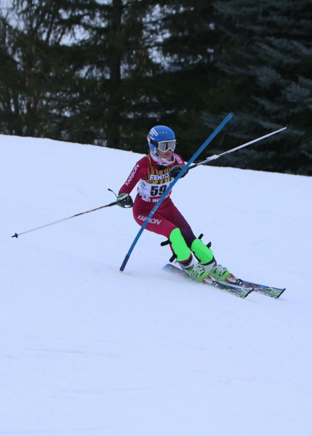Sophomore Emma Hiscock speeds around the gates at Mt. Holly in her slalom race against Powers Catholic. Fenton Linden ski team won the race.