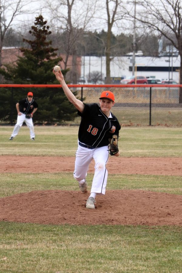 Striking the batter out, Freshman Dylan Davidson pitches the ball. The JV boys baseball team won their second game against Flushing with a score of 6-5.
