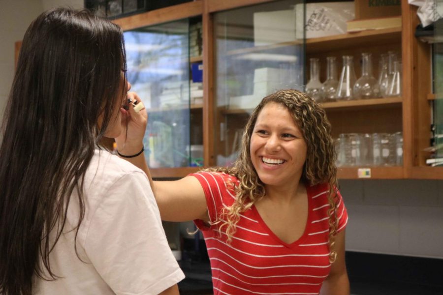 During an anatomy lab, juniors Kirsten Foor and Leaha Brackenridge test their ability to taste different foods without using their sense of smell. The lab had many different stations that were designed to teach students about their sense of smell and taste.