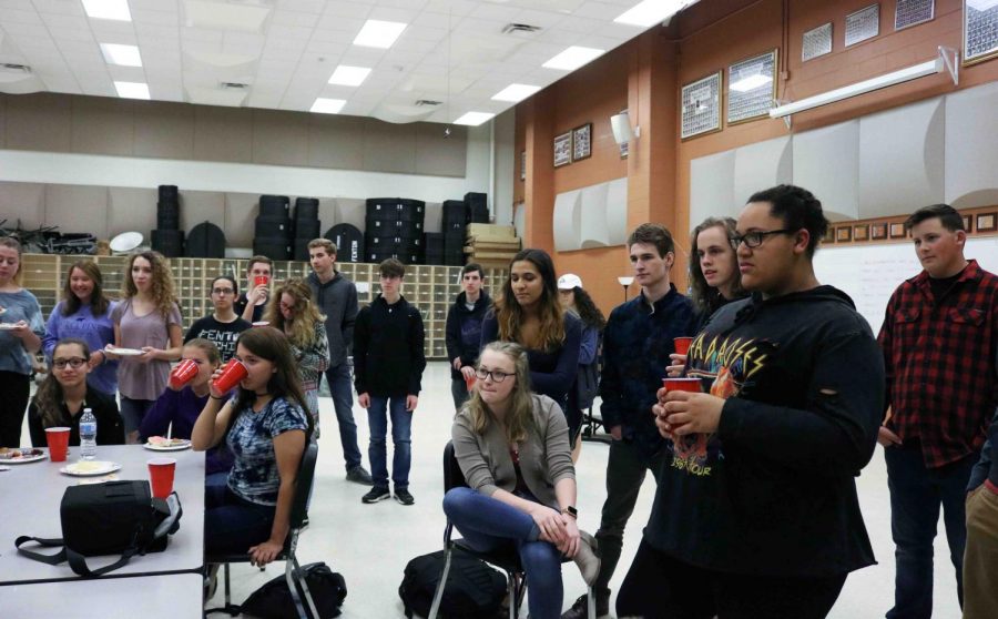 The Wind Ensemble celebrates their student teacher, Henry Pakelas, last day by watching him open his gifts he recieved. the bands next performance is at graduation in the main gym on June 10.