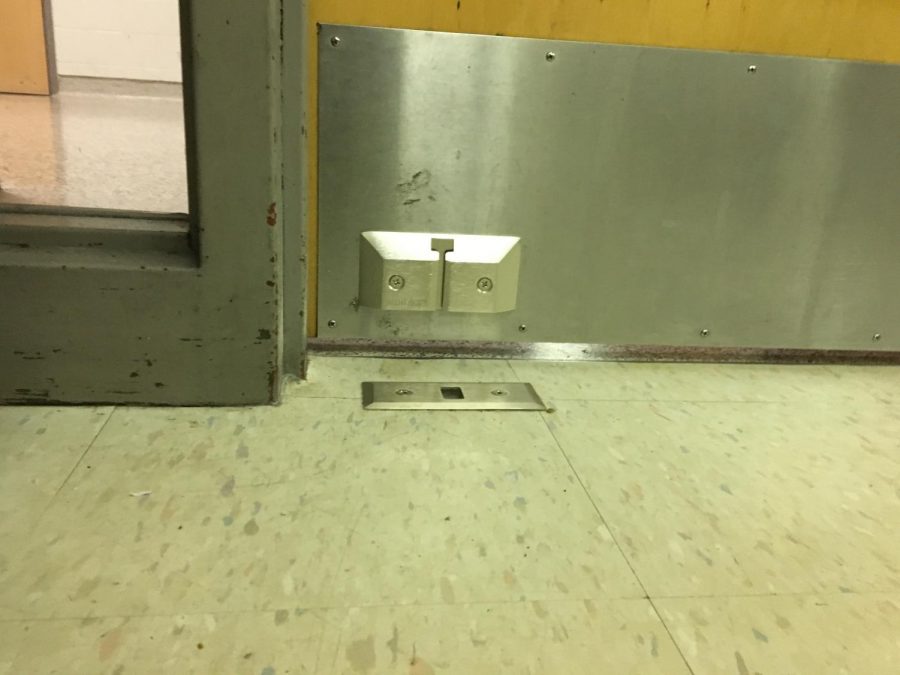 In the case of an emergency, students and staff slide the red metal piece into the Nightlock unit attached to the floor.
