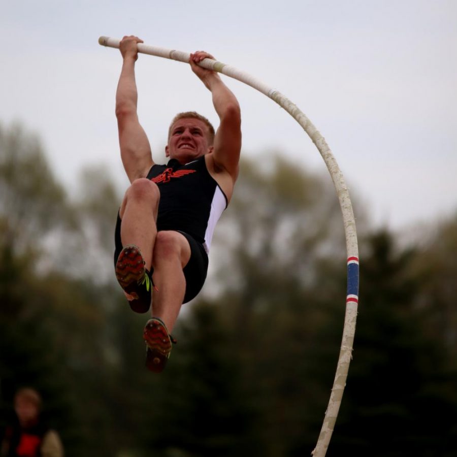 Competing in his event, junior Noah Maier pole vaults in the MHSAA regional track meet. Maier reached a new personal record of 126.