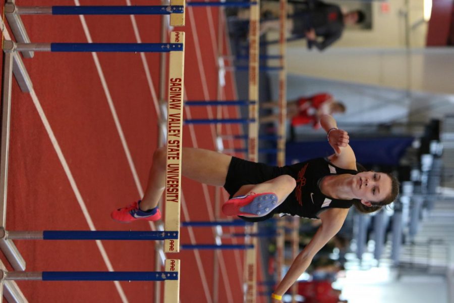 Jumping over the hurdles, junior Niki Matthe participates in her event . The Fenton track team took part in the SVSU invitationals to get ready for the season.