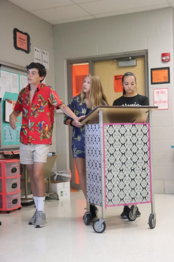 During the week of homecoming, freshman Sam Claborn, Jessica Dunkal and Maddy star, have a presentation for World History, as they are dressed in spirit wear. This day of spirit week was tacky tourist day.