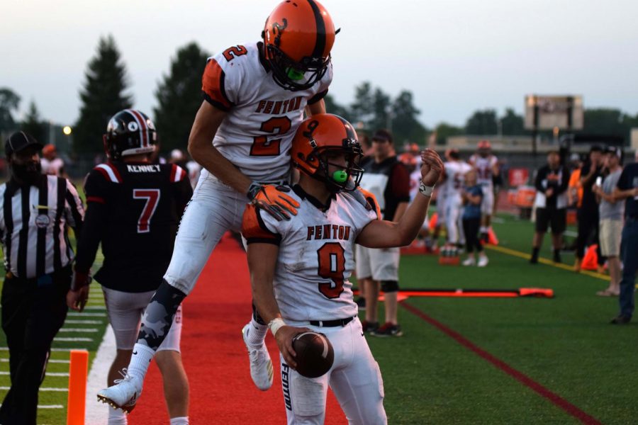 After scoring a touchdown, seniors Spencer Rivera and Cameron Steeves celebrate the six points on Linden. Rivera led the Tigers with multiple touchdowns to help them secure victory over the Linden Eagles, 34-7.