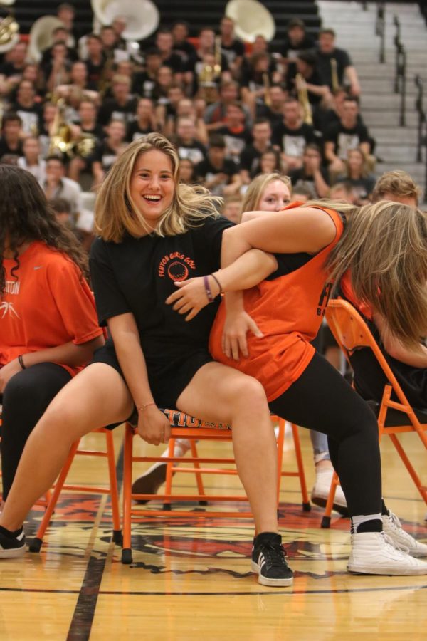 As the music stopped foreign exchange student Charlotte Cunaud fights junior Maria Ebert for the chair.  The junior class ended up winning the spirit stick.