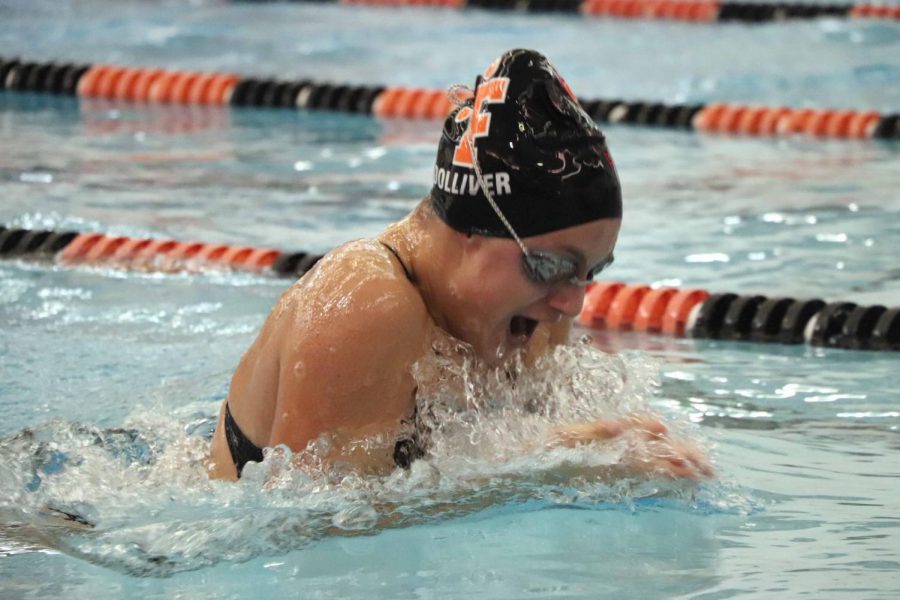 While coming up for air during her 100 yard breaststroke, sophomore Abby Dolliver takes the win against Grand Blanc High. The Fenton High girls swim team beat Grand Blanc 200-150.
