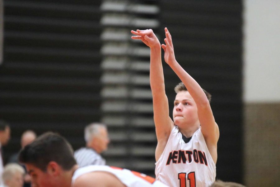 Aiming for the hoop, sophomore Cam Veres stands at the free  throw line. The Fenton boys JV basketball battled against Swartz Creek and won 60-45. 