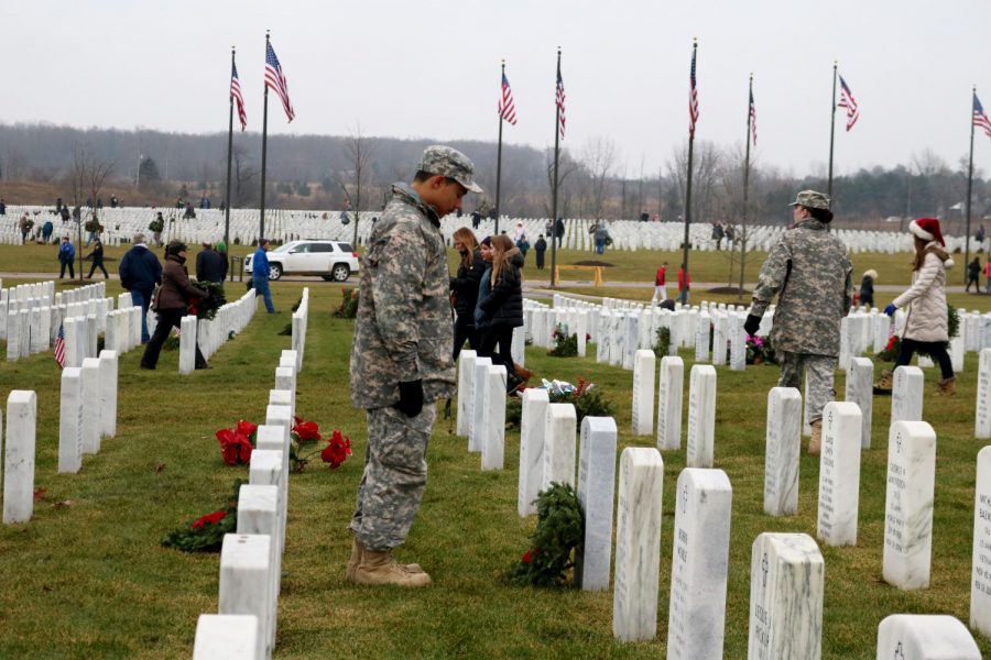 Cadet Black lays a wreath for the fallen soldier Thomas R. Gaulin. On 12-15, every year volunteers lay wreaths for the fallen soldiers of the army in Great Lakes National Cemetery. 