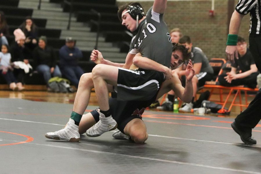 Junior Jayden Rittenbury takes down a Cilo student for his team on January 9. On Wednesdays meet Rittenbury placed 51 to 44.