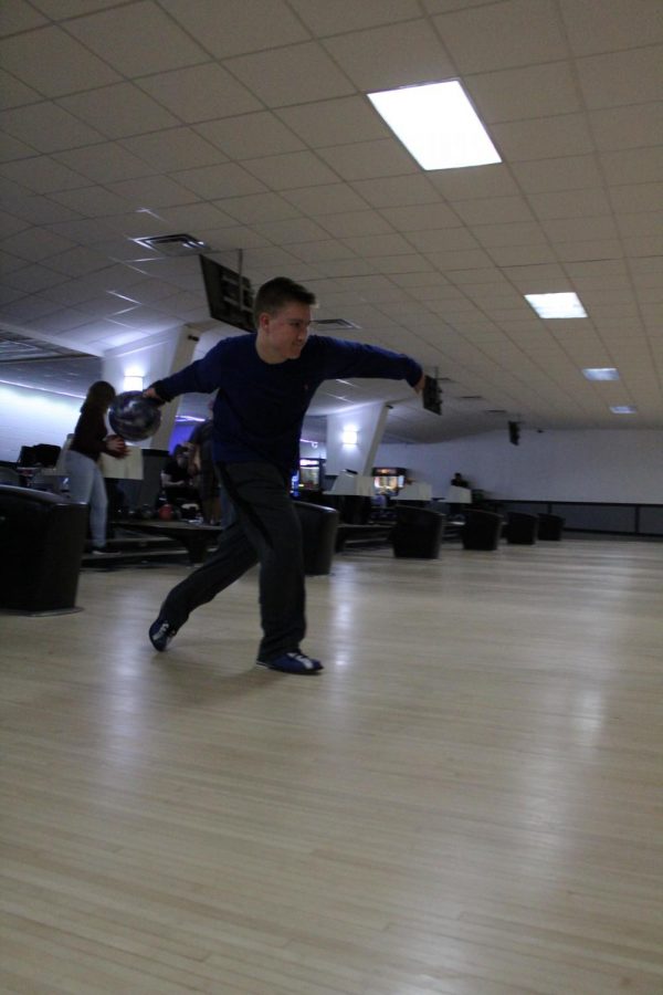 Sophomore Tate Temrowski tosses the ball down the lane.  The bowling team practices on Tuesdays and Fridays. 
