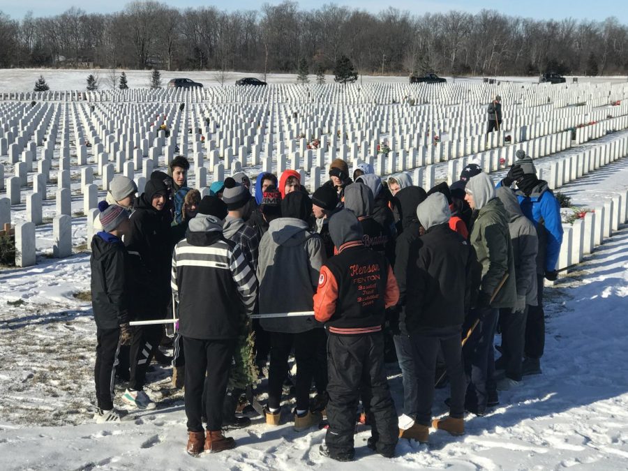 Students gather at the National Cemetery on Jan. 26. Junior and Senior boys took down the wreaths that were laid on the graves earlier in the season. 