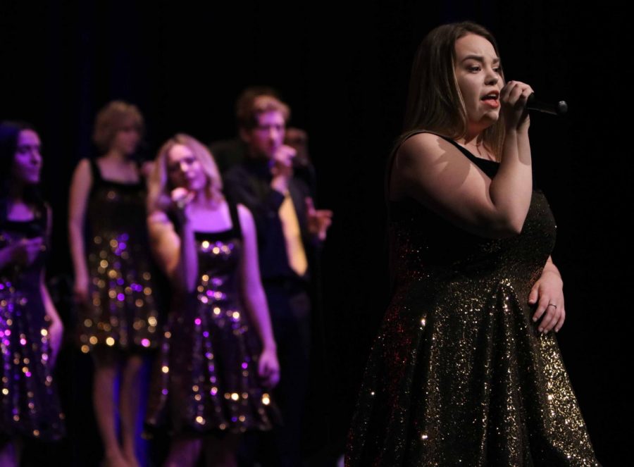 After going through hell week, senior Emily Hayes performs her solo at the Ambassadors concert on Feb. 23. Hayes started with the Ambassadors her freshman year of high school.