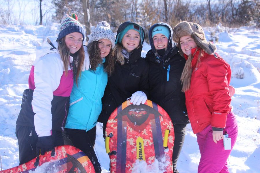 Juniors (left to right) Julia Adams, Maria Ebert, Brie Sanford, Audrey Weir and Julia Young pose for a photo on a snow day. 