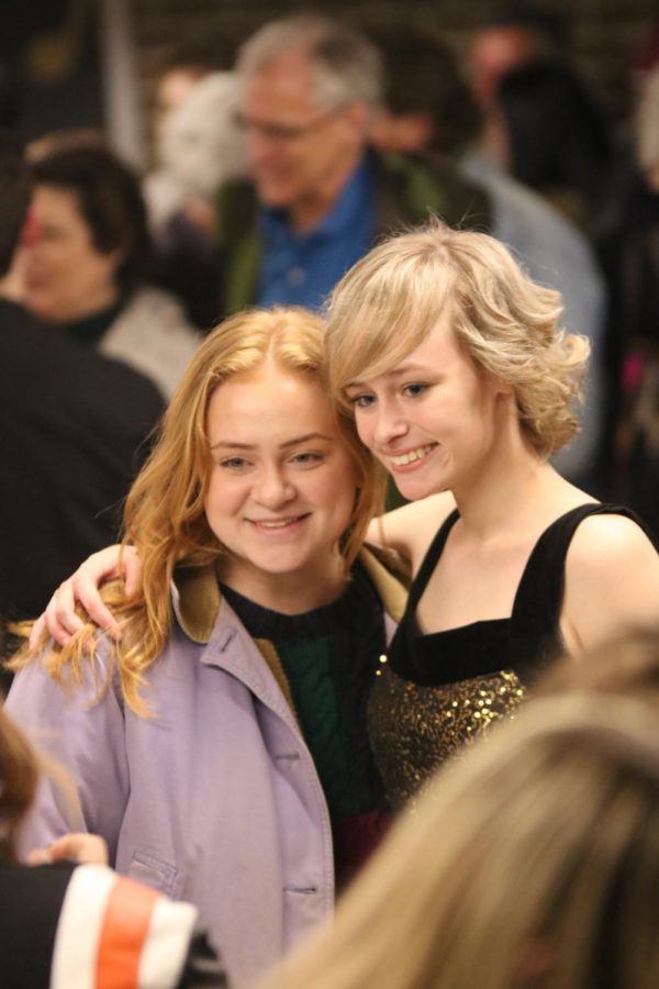 Juniors Zoe Simmerman and Emily Wright pose for a photo after an Ambassadors concert. The Ambassadors performed on Feb. 22 and 23. 