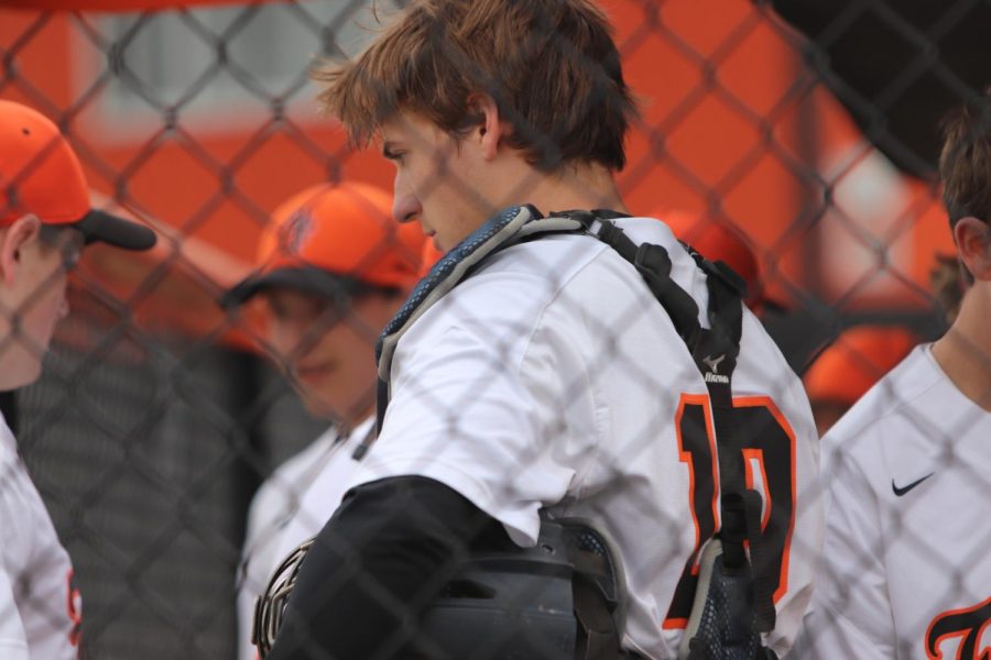 JV Baseball team catcher, sophomore Gannon Welch, discusses with his team their strengths and weaknesses from the previous inning. On April 25, the boys played against Swatrz Creek