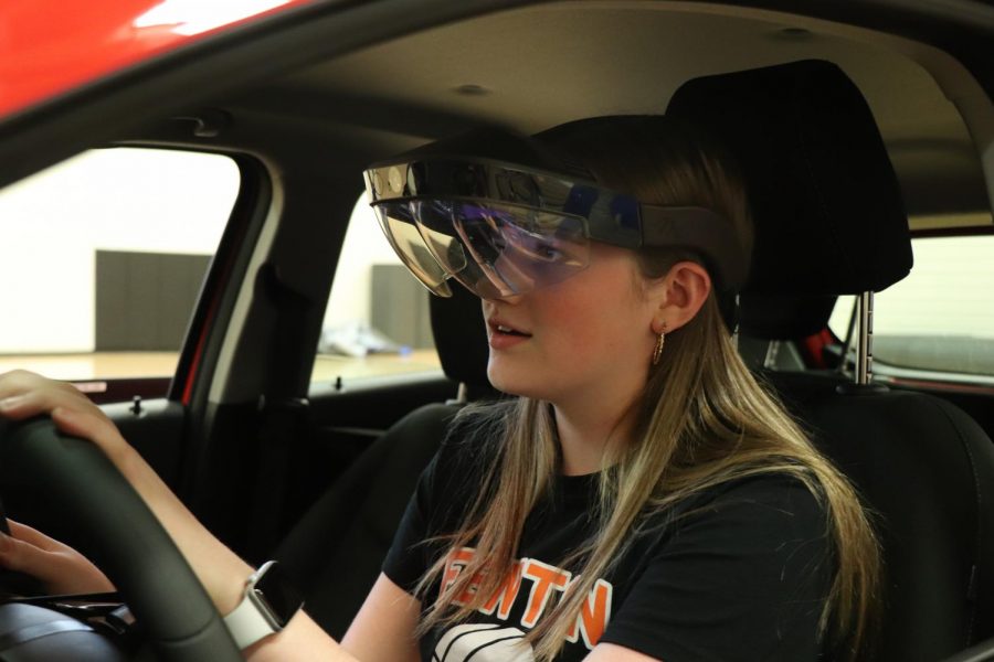 With her eyes on the road, freshman Peyton Graham tries out the distracted driving simulator. The P.E.E.R.S. Foundation taught gym classes the dangers of distracted driving on April 18th.