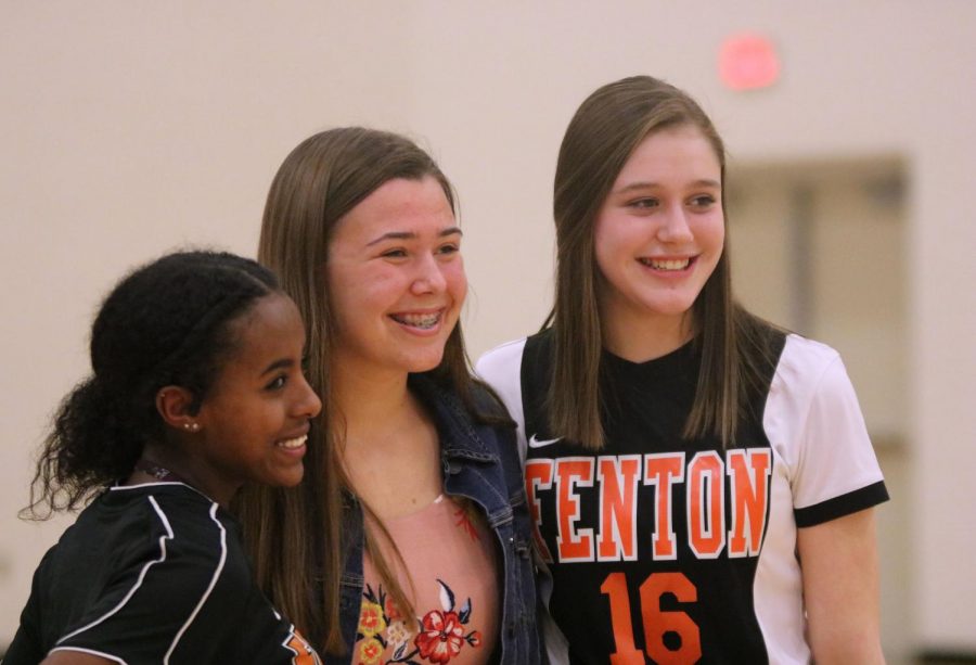 During meet the team, freshmen Aleena Garrison, Hannah Bollinger and Celeste Hindmon smile for the camera. Fenton High officially started spring sports earlier this month.  