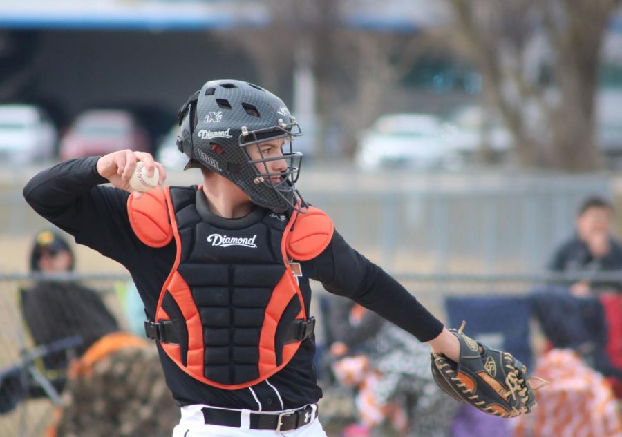 With a baseball in his hand, freshman David McDermott throws it back to Fenton High pictcher. The Fenton freshman boys baseball tied with Saline 3-3.