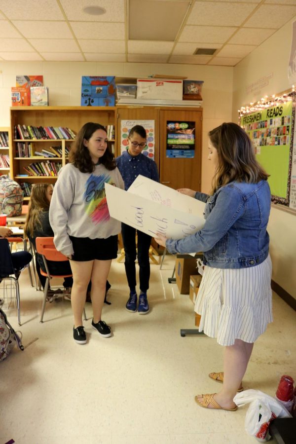 As she says her goodbyes, freshman Samantha Megdanoff gives her student teacher a card. The freshman advanced literature class threw a party to celebrate the semester they had with Rebecca Turri.