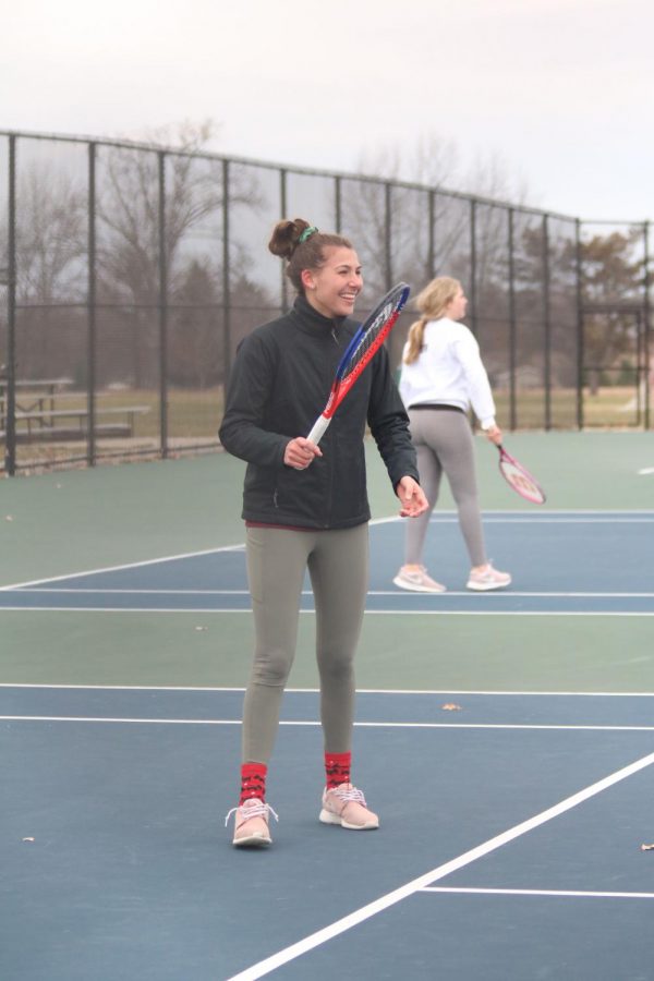 Hitting the tennis ball to her opponent, freshman Josie Cherney scores for the Fenton high JV girls tennis. They played against South Lyon on Apr. 10. 