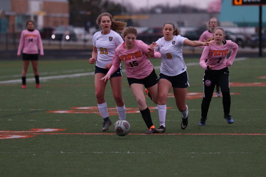 As she attempts to break through the defense freshman Allie Browne makes her way toward the goal. The JV soccer team plays Lapeer on May 8.
