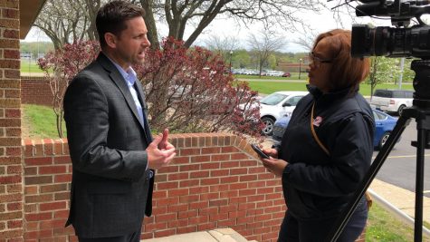 Superintendent Adam Hartley speaks with a reporter on Friday, May 17.
