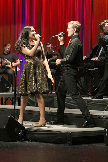 At their concert, junior Karenna Mansour and senior Jake Humpert sing and dance. The Ambassadors had their 40th anniversary show on May 10 and 11.