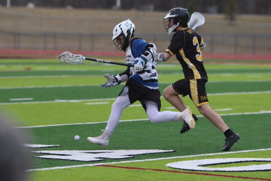 As he makes a break from the defensive player junior Heyden Justus makes his way toward the goal. The varsity Fenton-Linden Lacrosse team’s next game is against Swartz Creek on May 7.
