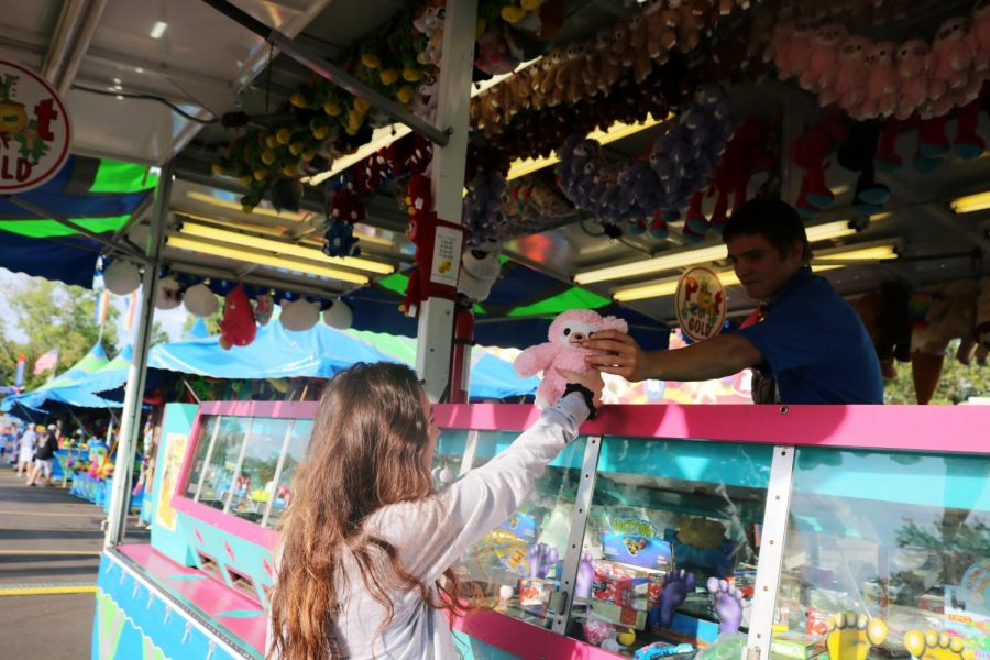 Along with going on fun rides at Applefest, senior Shayla Smith wins a stuffed animal prize at one of the games.  Applefest started Sept 12 and ended Sept 15.