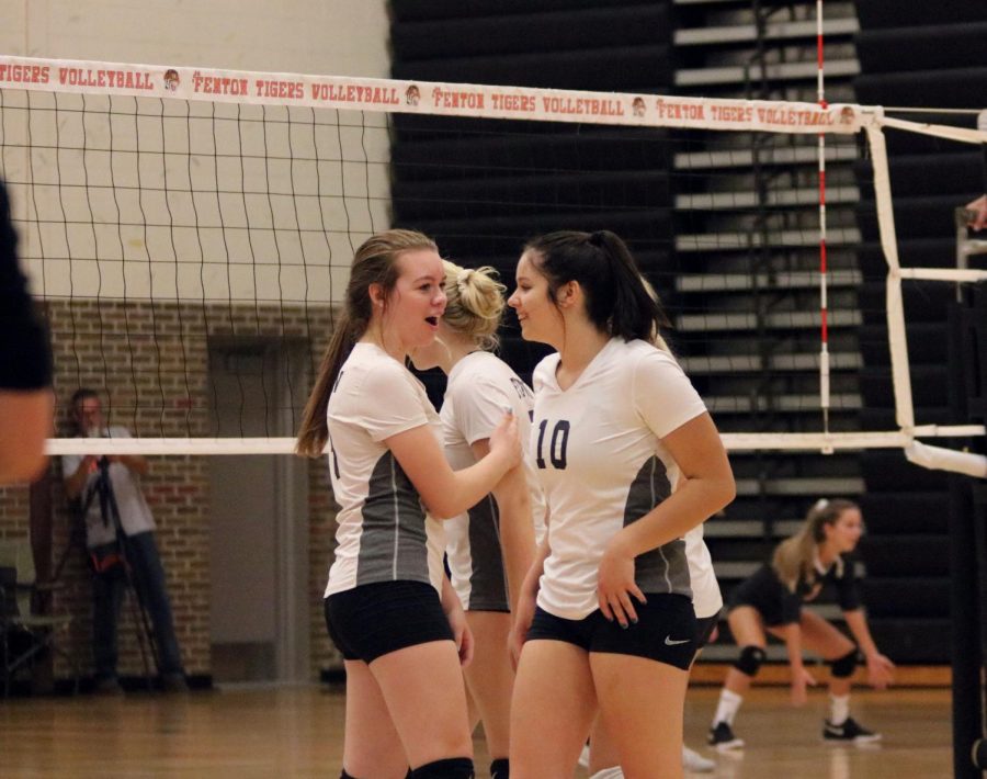 Sophomore Maddy Stevens high fives her teammate Sophomore Katie Premo. On September 25th, the JV Volleyball team played Flushing at home winning all 3 games.