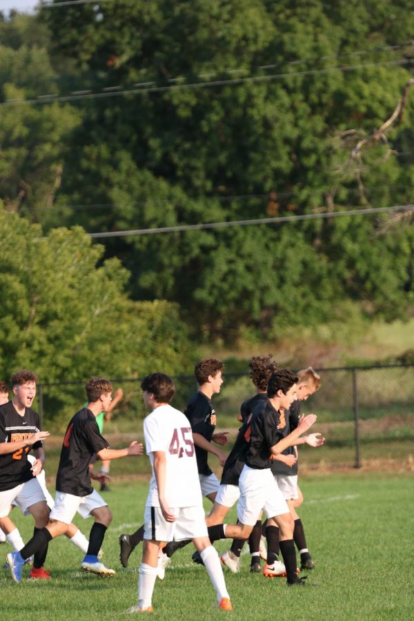 The JV Soccer team runs back to defense after scoring a goal on September 9th against Dexter. Fenton won with a final score of 3-1.
