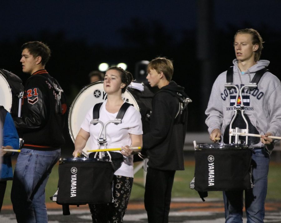 Seniors Jenna Maher and Cale Mitchell both play the snare in marching band. The band attends 0-hour at 6:30 am every day on the field to rehearse their halftime time show.
