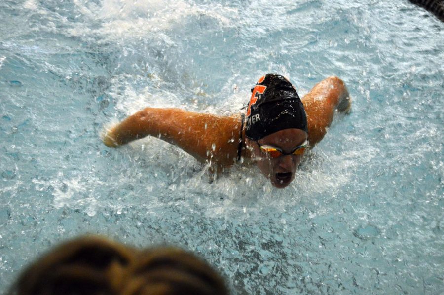 Swimmer Abigail Dolliver swims the girls 200 yard individual medley (IM) in lane 4 on Sept. 21. She placed first for the swim with a time of 2:21.08.