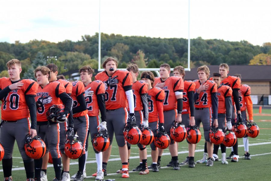 The boys freshman football team lines up during the national anthem right before their game with Grand Ledge. The game was played on Oct. 17 and it was the last home game of the year.