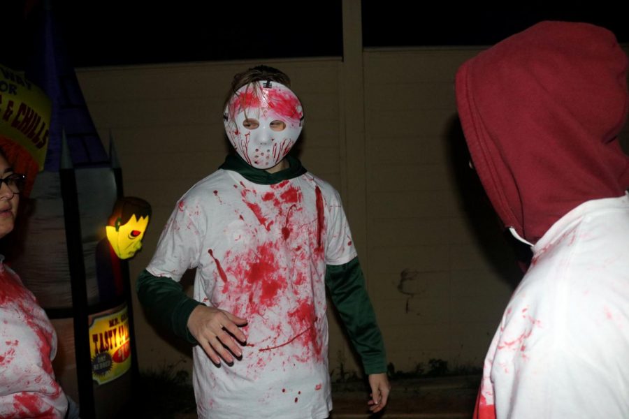 Senior Cale Mitchell acts as a scarer for the Haunted House fundraiser that the InPrint staff held. 