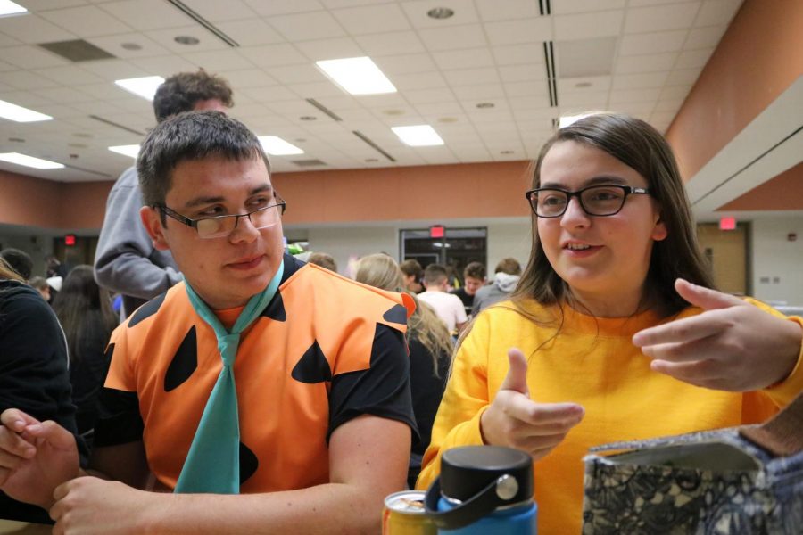 For homecoming spirit week, sophomores Dakota Naganashe and Marie Herzog are dressed as Fred Flintstone and Arthur for cartoon day. Students enjoyed participating in spirit week in preparation for the big game on Oct. 11 and dance on Oct. 12.