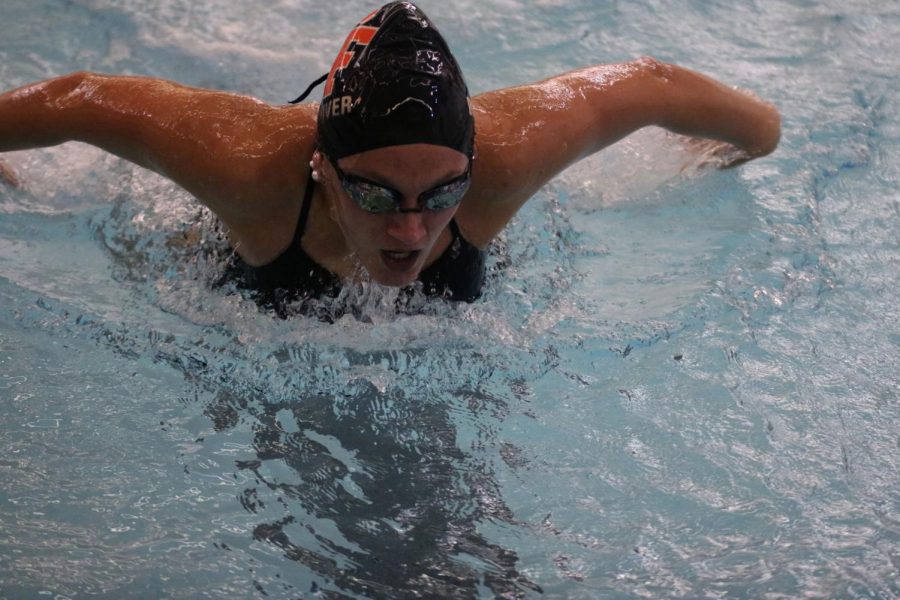 Junior Abby Dolliver takes a breath from the 100M Butterfly. On Oct.23, The Fenton Varsity Girls Swim & Dive beat Holly, Kearsley, and Lake Fenton.