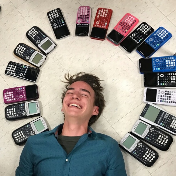 “The idea for the picture came from the fall theme of playing in the leaves,” sophomore Chase Gibson said, “so we tried to make it look like I was playing in the calculators.”