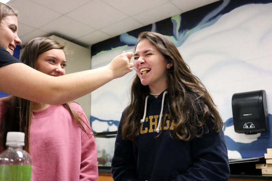 Junior Lydia Anderson watches as junior Charley Holcomb feeds junior Sydney Butka a raw potato for their Anatomy lab. On Nov. 7, Mishael Kunji had his fourth 
hour Anatomy class perform an experiment where they had to figure out parts of the tongue by taste-testing different types of foods. 