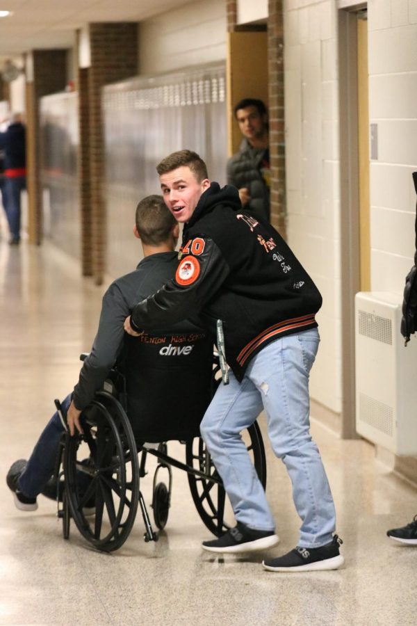 Practicing a safe mindset, senior Brady Triola helps his friend escape from the idea of a school shooter. All of Fenton High practiced their safety procedures on Oct. 18. 