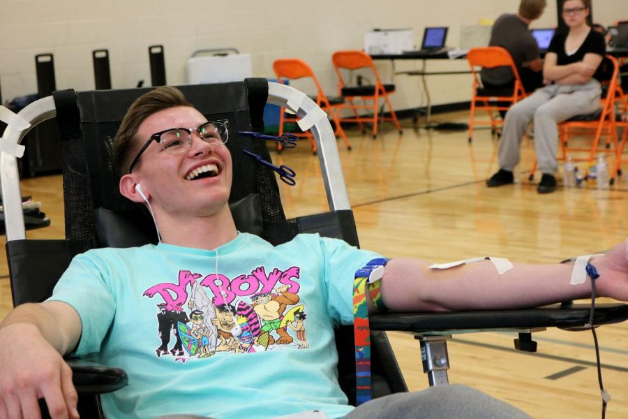 Junior Hunter Foster laughs as he gets his blood drawn. On Jan. 9 National Honor Society partnered with the Red Cross and hosted a blood drive during school in which students had the opportunity to donate and save a life. 