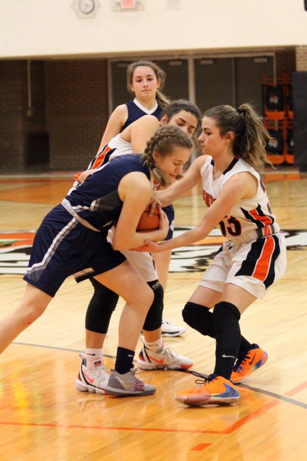 Freshman Sophia Hense tries to steal the ball from her opponent. On Jan. 22, Fenton versed South Lyon at home and won 51-16.