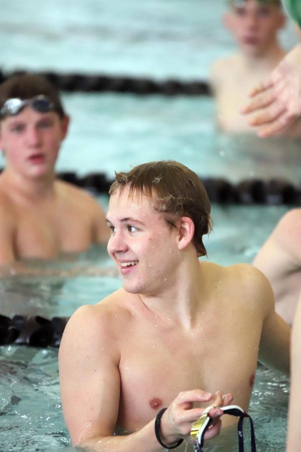 During+a+break+in+between+sets%2C+senior+swim+captain+Jake+Kennedy+talks+among+his+teammates.+The+boys+swim+team+practices+everyday+after+school+from+3-5+p.m.