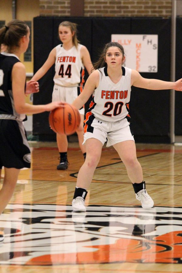 On Feb. 4, freshman Madison LaRowe defends the basket from her opponent. Fenton freshman girls basketball went against South Lyon at Fenton High School and won 46-20.