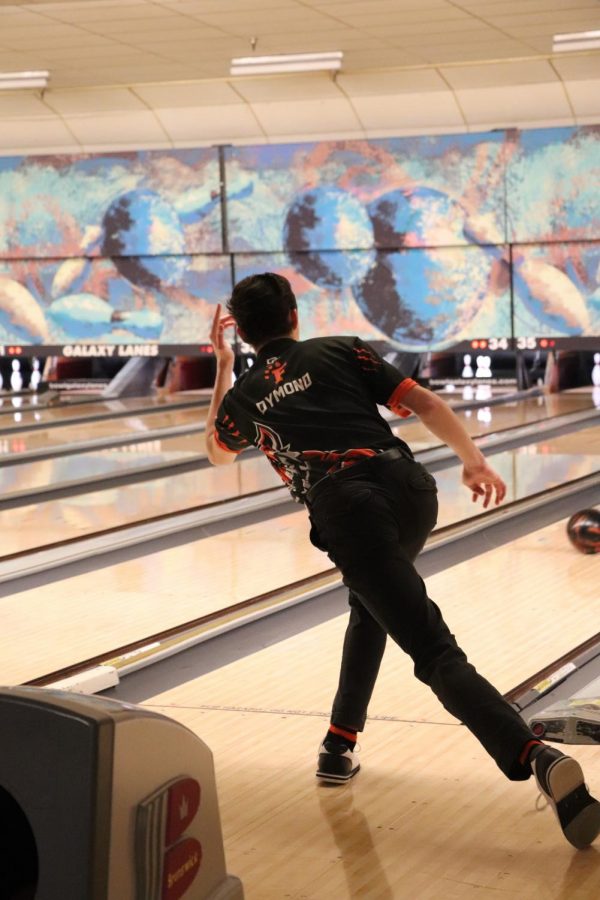 Sophomore Nate Dymond bowls his frame at his bowling match. On Feb. 1 the Fenton junior varsity bowling team faced Clio. 